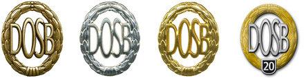 Vier Medaillen des DOSB in Gold, Silber und Bronze, sowie eine besondere Medaille mit der Aufschrift "20".